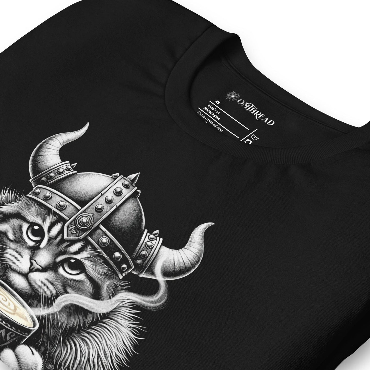 OMTHREAD A Battle Is Brewing Viking Cat black T-Shirt featuring a fierce feline in Norse warrior gear holding a steaming cup of coffee. Perfect for coffee lovers, cat enthusiasts, and Viking mythology fans. Soft cotton unisex tee.