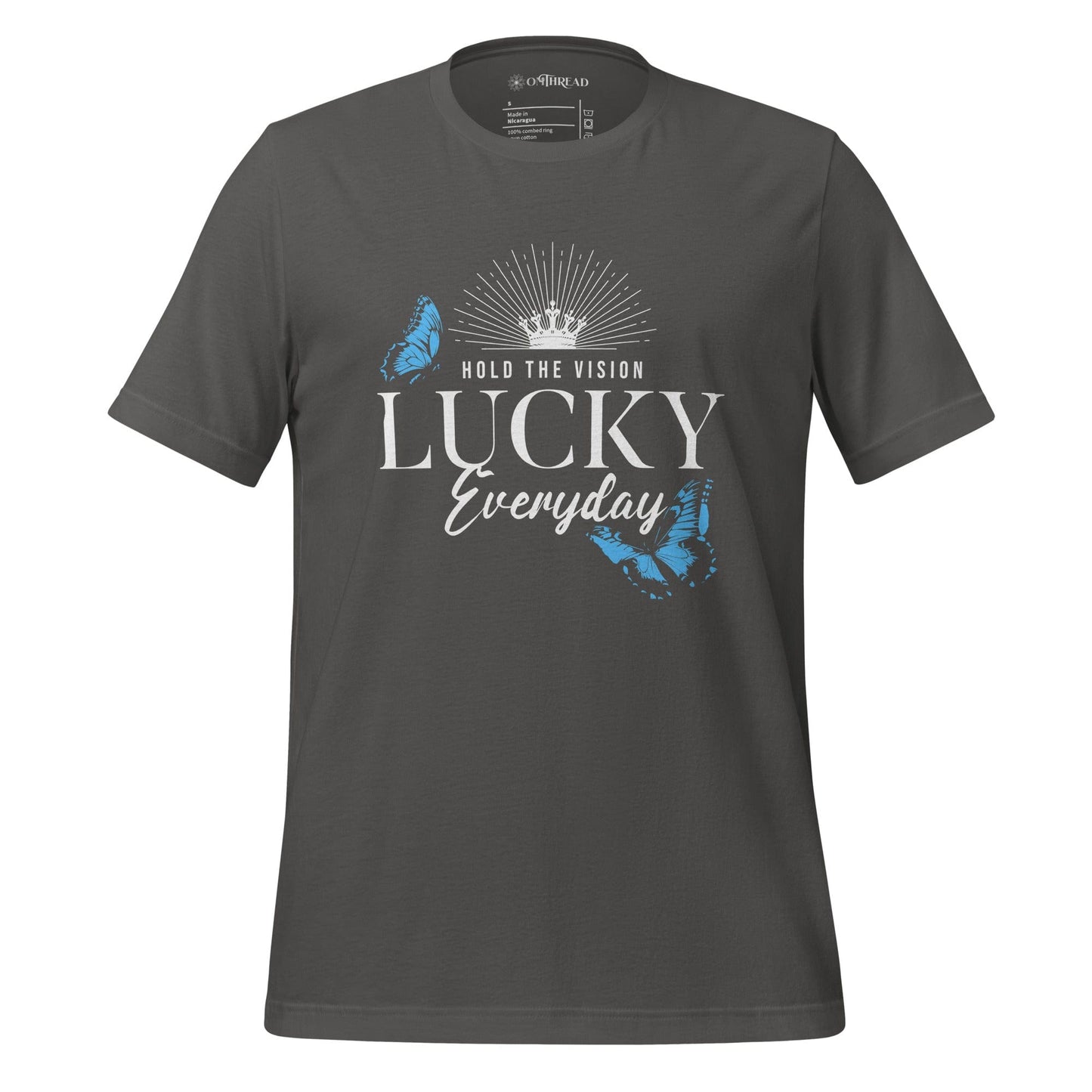 OMTHREAD gray t-shirt featuring the text "Hold the Vision" above "LUCKY Everyday" with a crown and butterfly designs in blue, creating a motivational and inspirational visual.