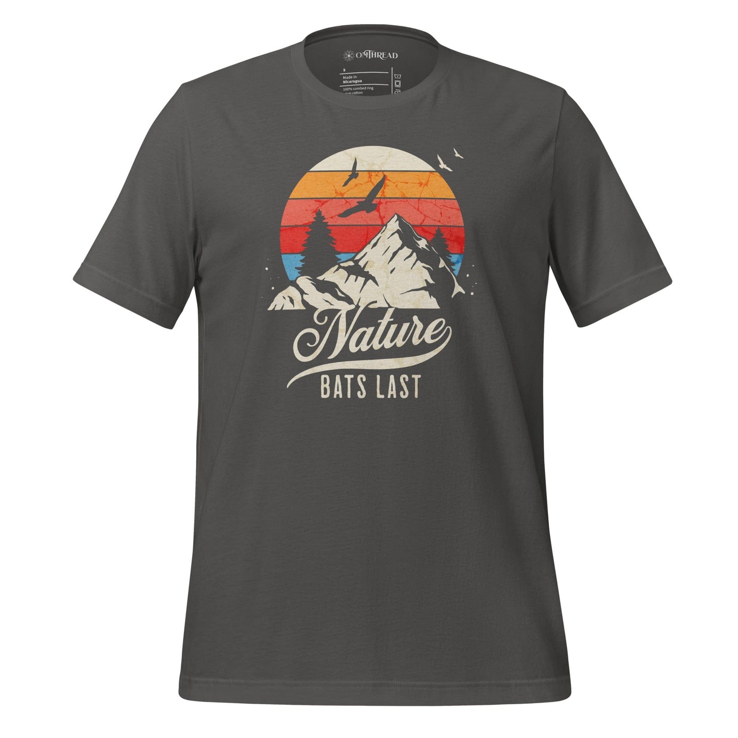 OMThread light gray t-shirt featuring a retro-style mountain landscape with a sunset and birds in flight, displaying the phrase "Nature Bats Last" in vintage typography.