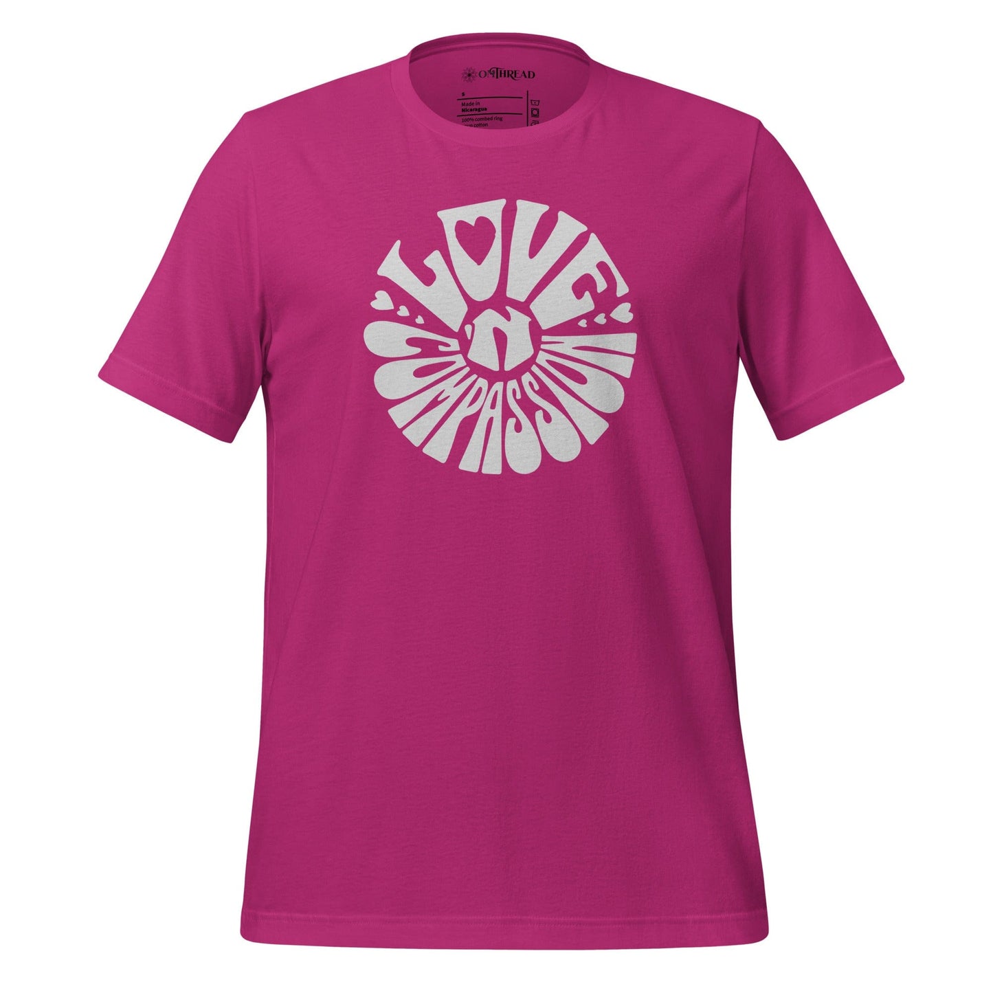 OMTHREAD barbie pink t-shirt with bold white "Love 'N Compassion" typography design in a circular layout