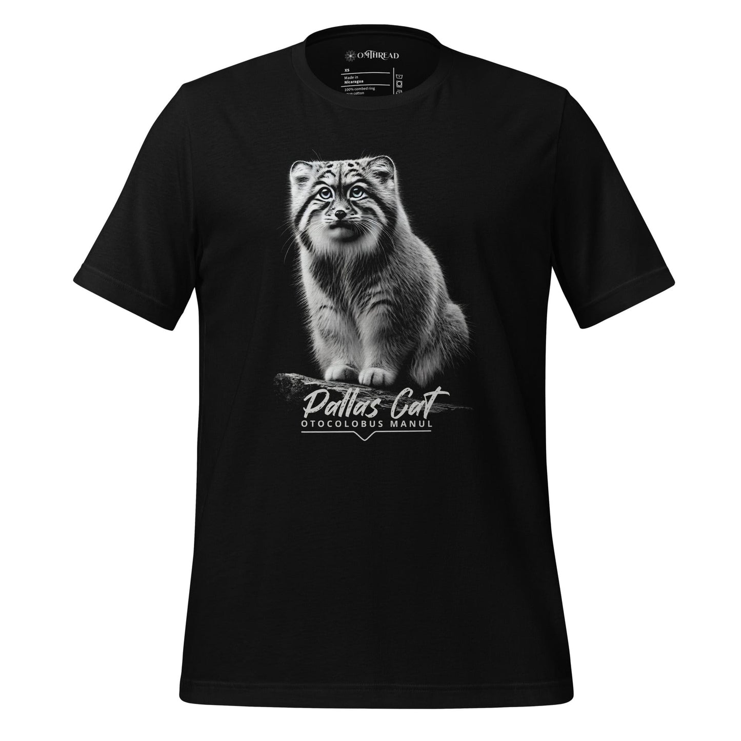 OMThread black t-shirt featuring a detailed black-and-white illustration of a Pallas cat sitting on a branch. The cat has intense eyes and finely detailed fur. Below the image, "Pallas Cat" is written in an elegant script, with "Otocolobus Manul" in a modern font.