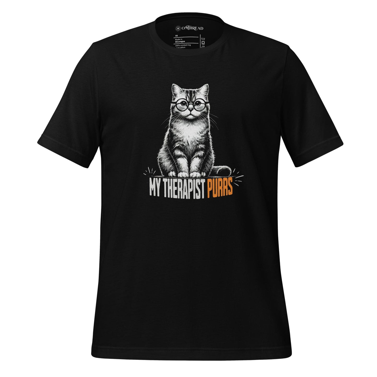 OMTHREAD black t-shirt featuring an illustrated cat wearing round glasses, sitting upright with a calm expression. Below the cat, bold text reads "My Therapist Purrs," with "Purrs" highlighted in orange.
