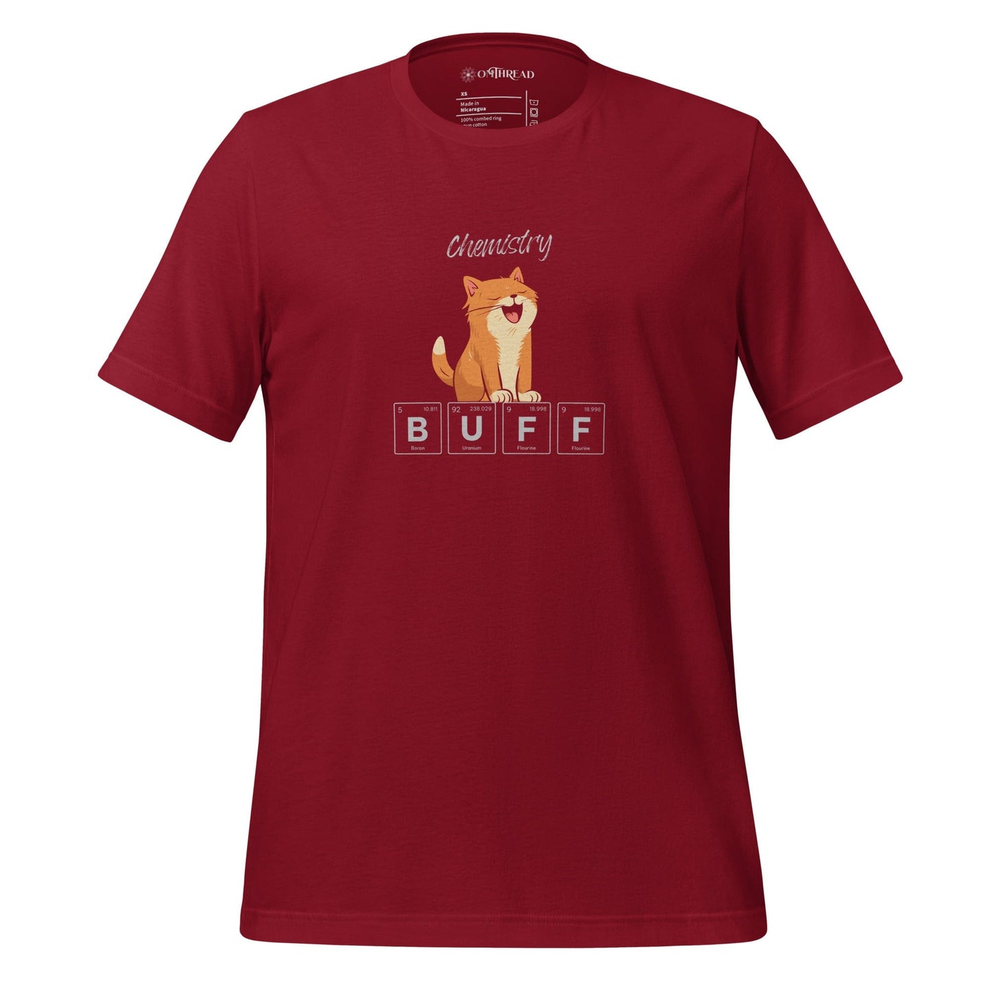 OMThread red cardinal t-shirt featuring an orange cat flexing its muscles above periodic table elements spelling "BUFF." The design combines science and humor, with the word "Chemistry" written above.