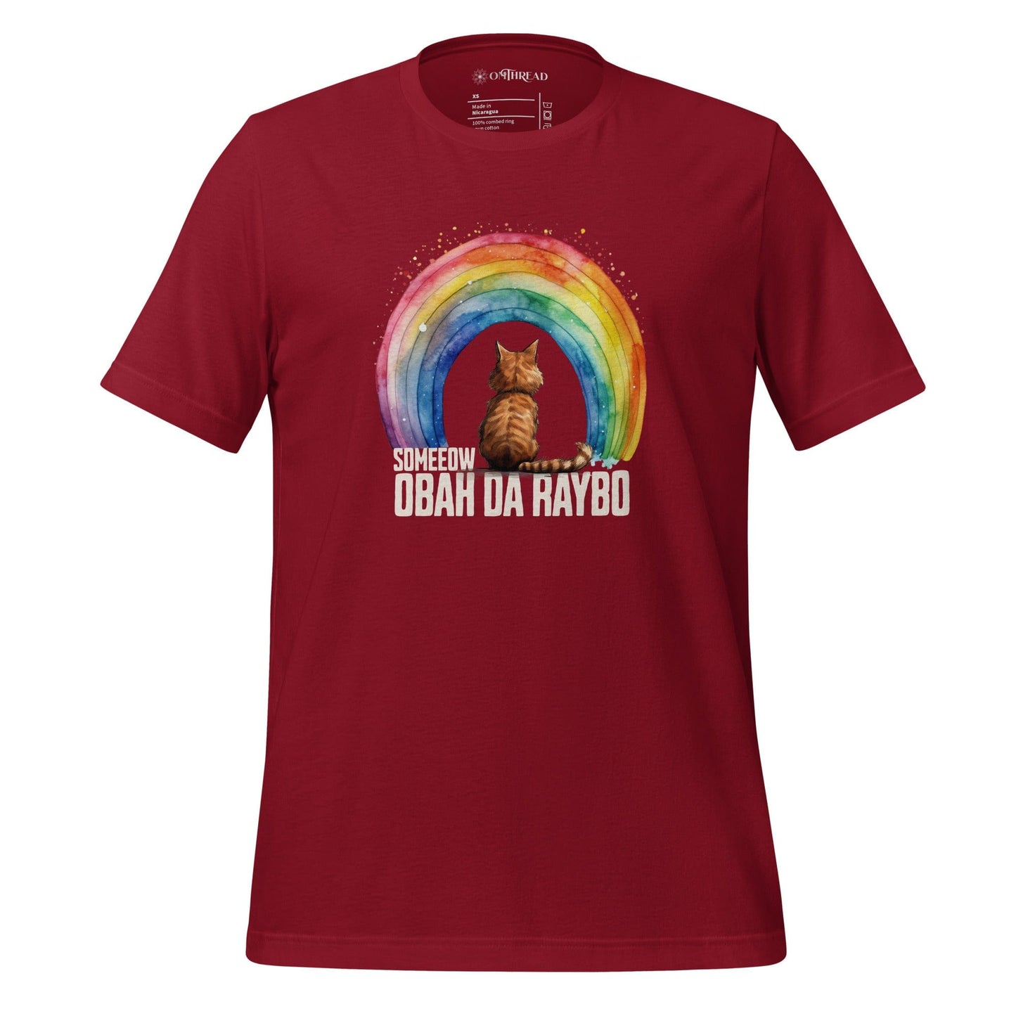 OMTHREAD Someeow Obah Da Raybo cardinal red T-shirt featuring a watercolor-style rainbow with a cat sitting in front, text below reading "Someeow Obah Da Raybo.