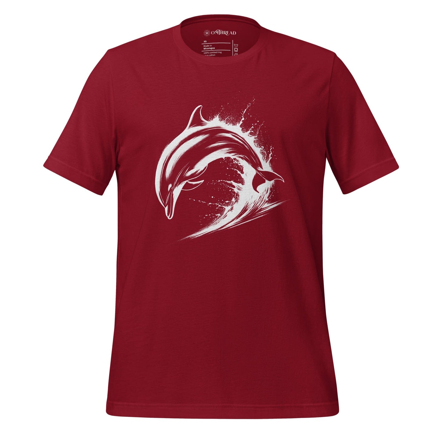 OMTHREAD red cardinal t-shirt featuring a white dolphin mid-leap over ocean waves, designed in a bold, high-contrast style.
