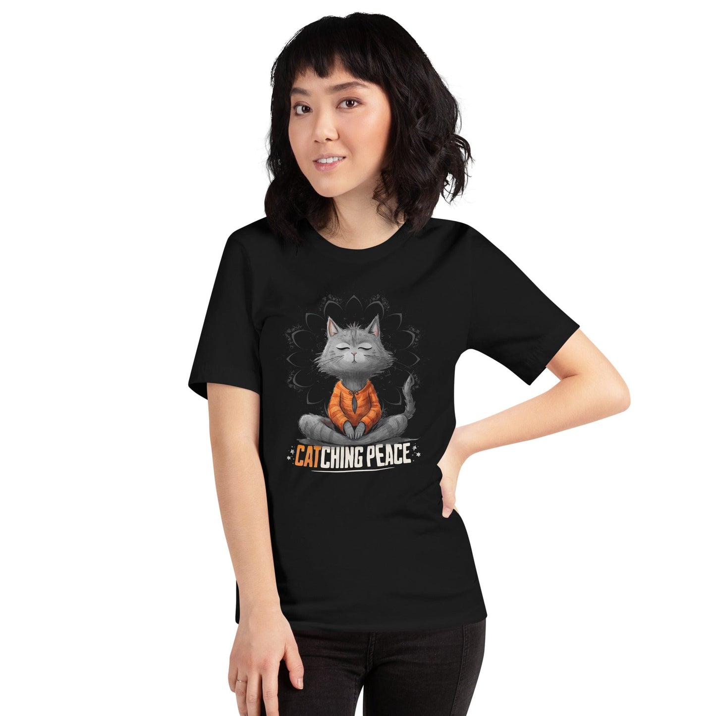Black t-shirt featuring a meditating cat in a peaceful lotus pose, surrounded by a mandala-inspired design. Below the cat, the text reads 'Catching Peace' in bold typography. Ideal for yoga lovers, mindfulness seekers, and cat enthusiasts.