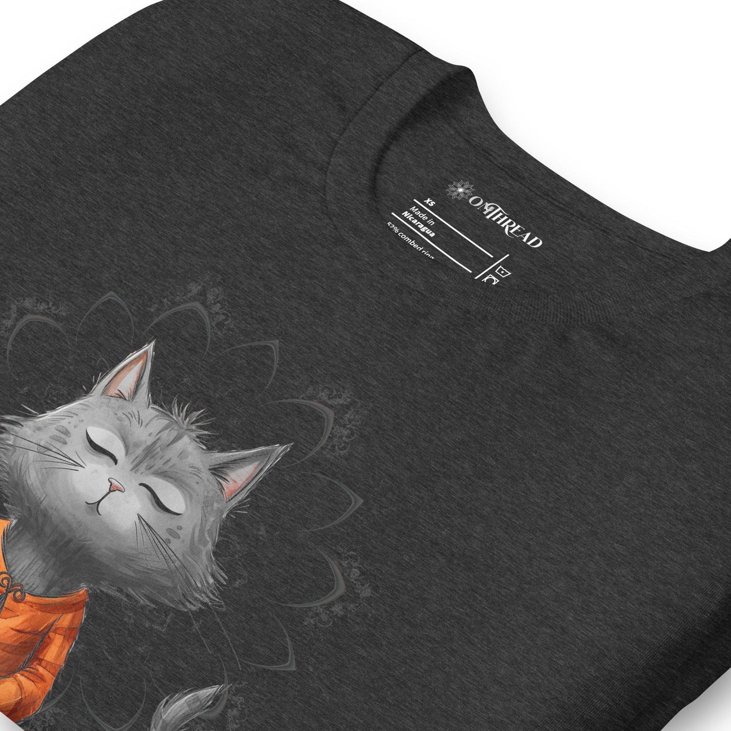 Dark gray t-shirt featuring a meditating cat in a peaceful lotus pose, surrounded by a mandala-inspired design. Below the cat, the text reads 'Catching Peace' in bold typography. Ideal for yoga lovers, mindfulness seekers, and cat enthusiasts.