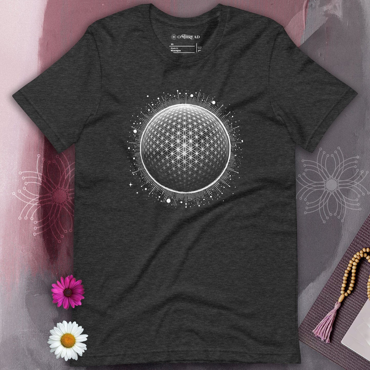 OMTHREAD's dark gray tee mesmerizing geometric sphere tee, symbolizing the interconnectedness of all things