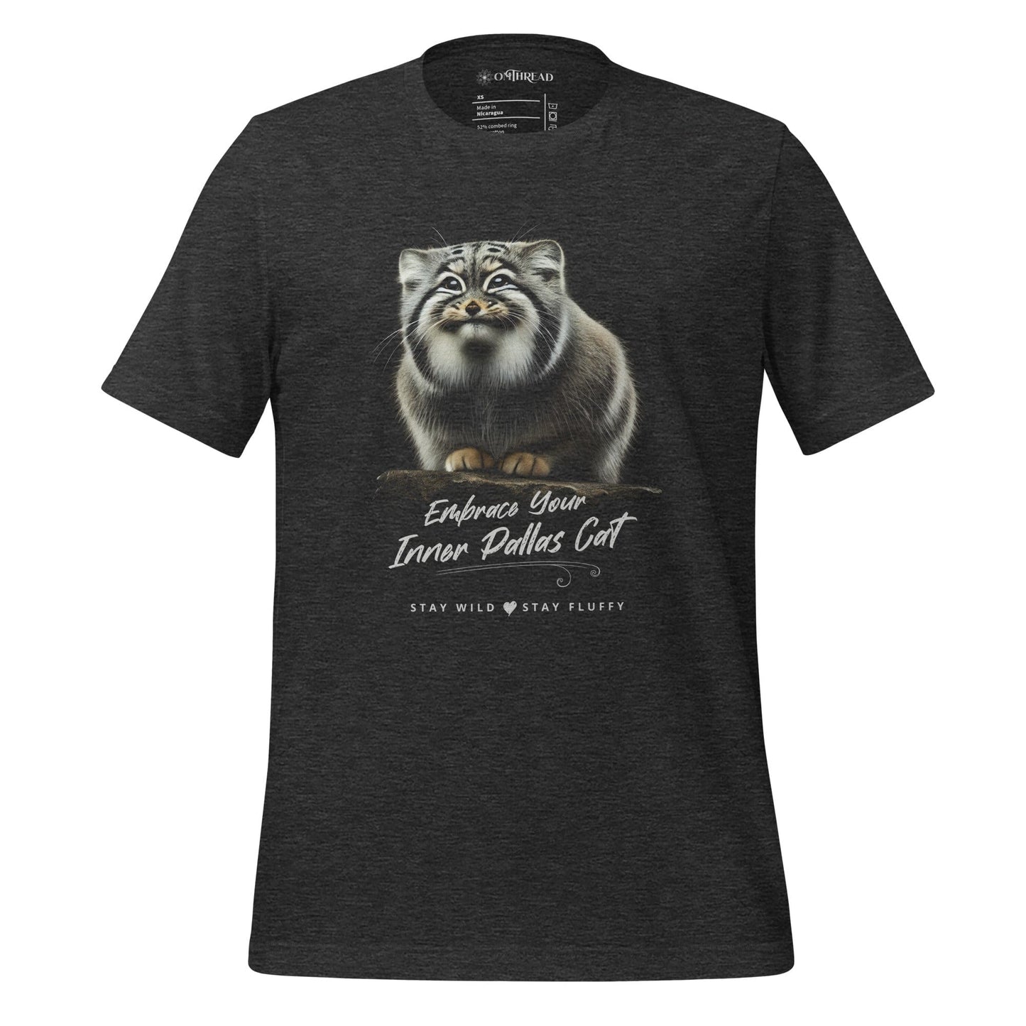 OMThread dark gray t-shirt featuring a detailed black-and-white illustration of a Pallas cat standing on a rock. The cat has thick fur and piercing eyes. Below the image, "Embrace Your Inner Pallas Cat" is written in elegant white script, followed by "Stay Wild Stay Fluffy" in a modern font