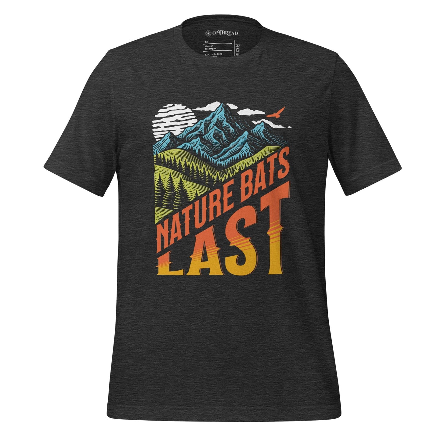 OMThread dark gray t-shirt featuring a bold "Nature Bats Last" design with stylized mountains, forests, and a sunset gradient. High-contrast typography with an outdoor adventure and climate awareness theme.