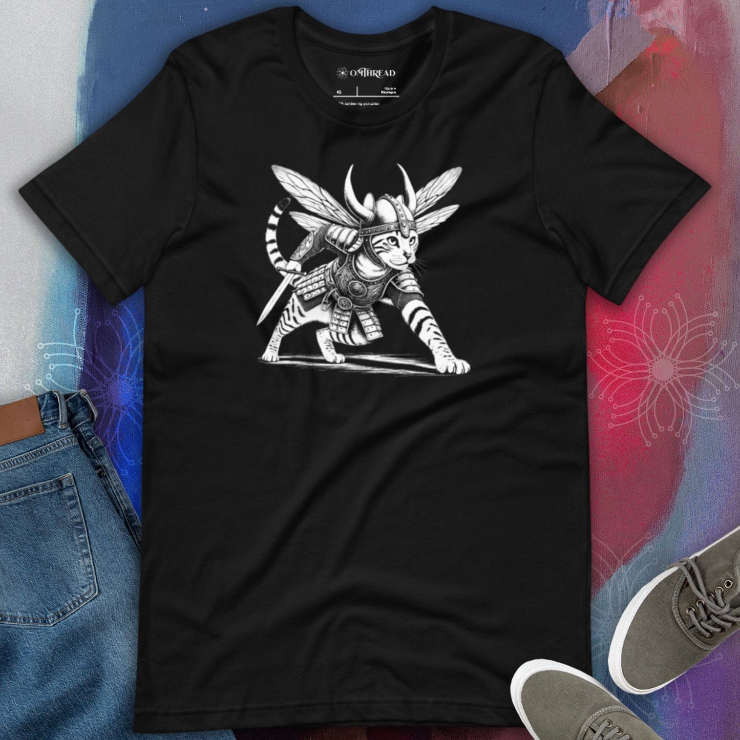 OMThread black t-shirt featuring an intricately illustrated Viking warrior cat in a battle-ready stance, wearing detailed armor, a horned helmet, and insect-like wings, holding a sword.