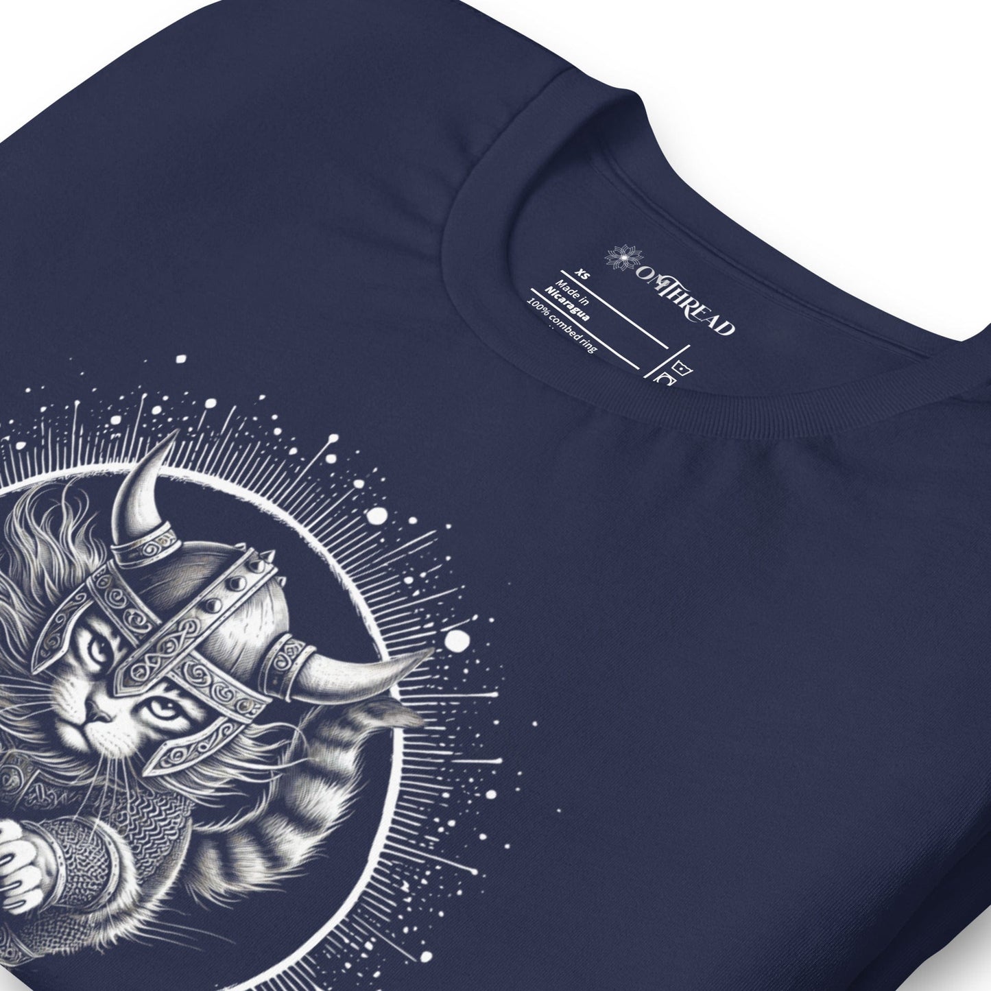 Navy t-shirt featuring a Viking cat warrior leaping forward, wearing a horned helmet and armor, set against a cosmic circular background with radiant lines.
