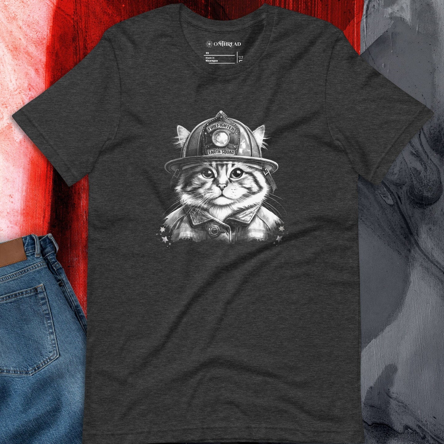 OMThread firefighter cat dark gray t-shirt, featuring a detailed black and white illustration of a cat wearing a firefighter helmet with "Earth Squad" text.