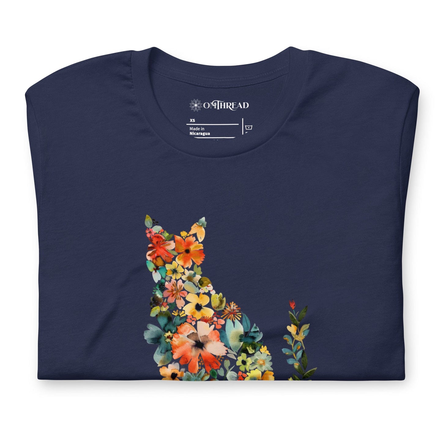 Navy blue t-shirt featuring a floral cat silhouette made of blooming flowers in vibrant colors. Below, the text 'Flower Child' is written in artistic script.