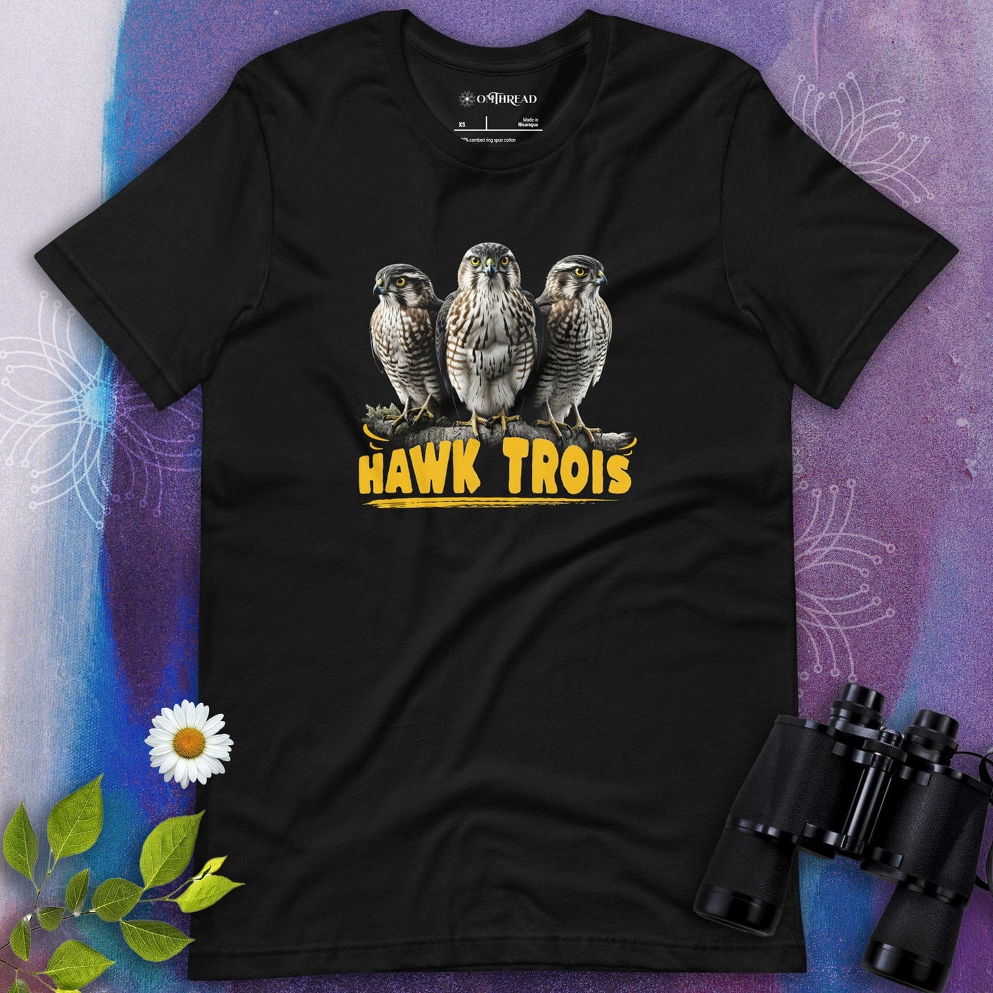 OMTHREAD black t-shirt with Hawk Trois design featuring three hawks perched together with bold yellow text