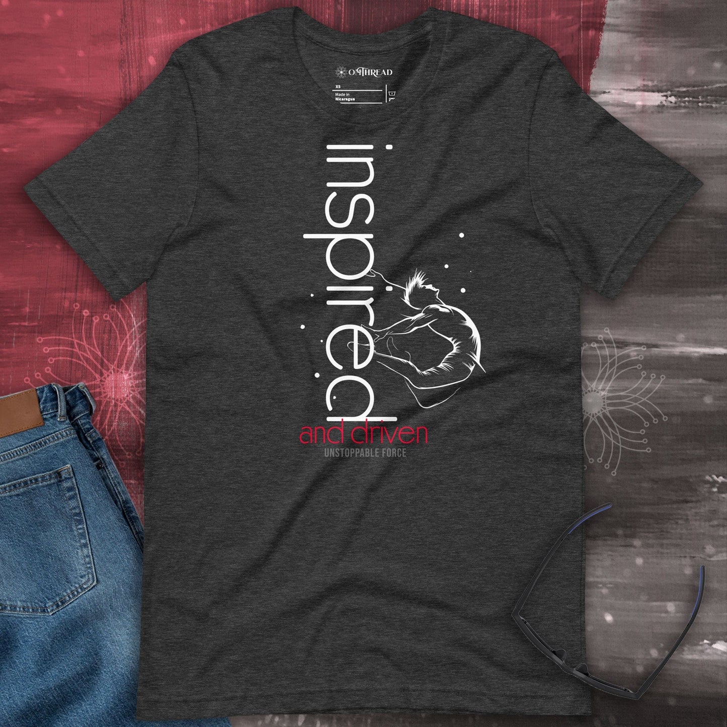 OMThread dark grey heather t-shirt with "Inspired and Driven" typography and an abstract figure in motion, symbolizing motivation and determination