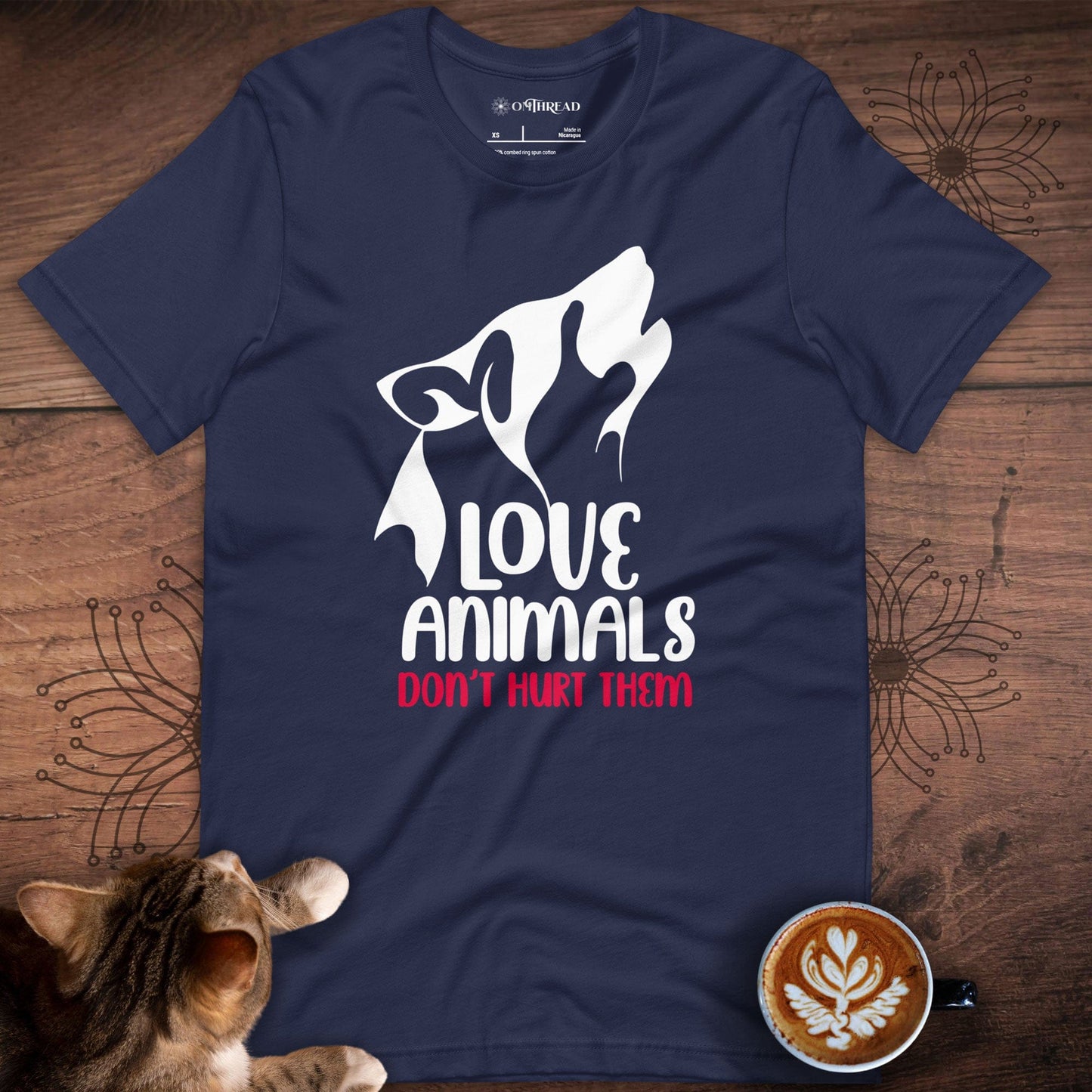 OMThread navy t-shirt featuring a white and red design of a stylized wolf howling with the words "Love Animals, Don't Hurt Them" in bold typography
