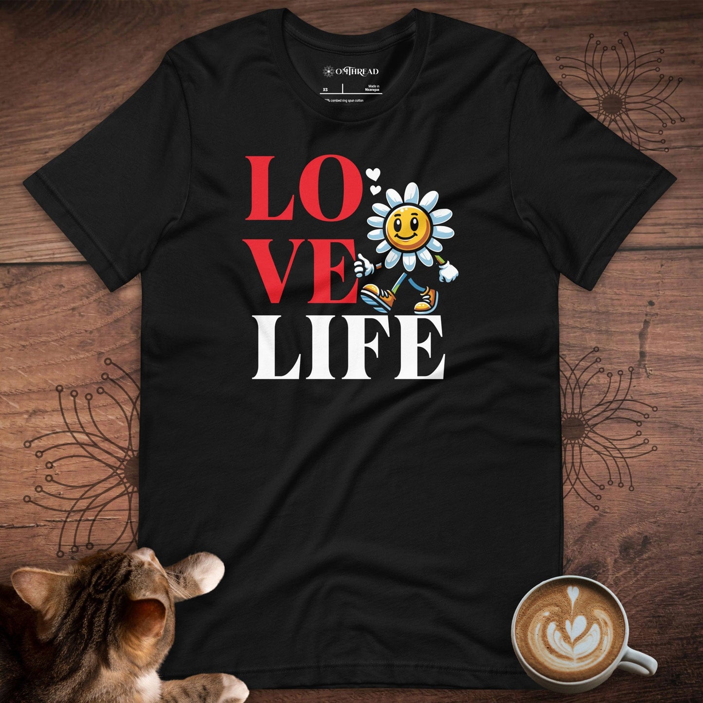 OMTHREAD black t-shirt with "LOVE LIFE" design featuring a smiling flower character and hearts.