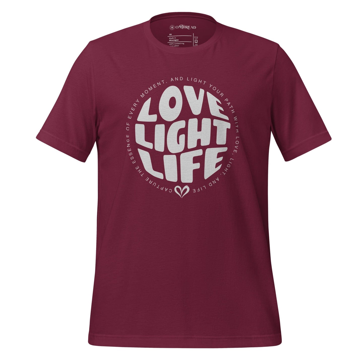 OMTHREAD maroon t-shirt with white circular text design reading "LOVE LIGHT LIFE," surrounded by a positive affirmation.