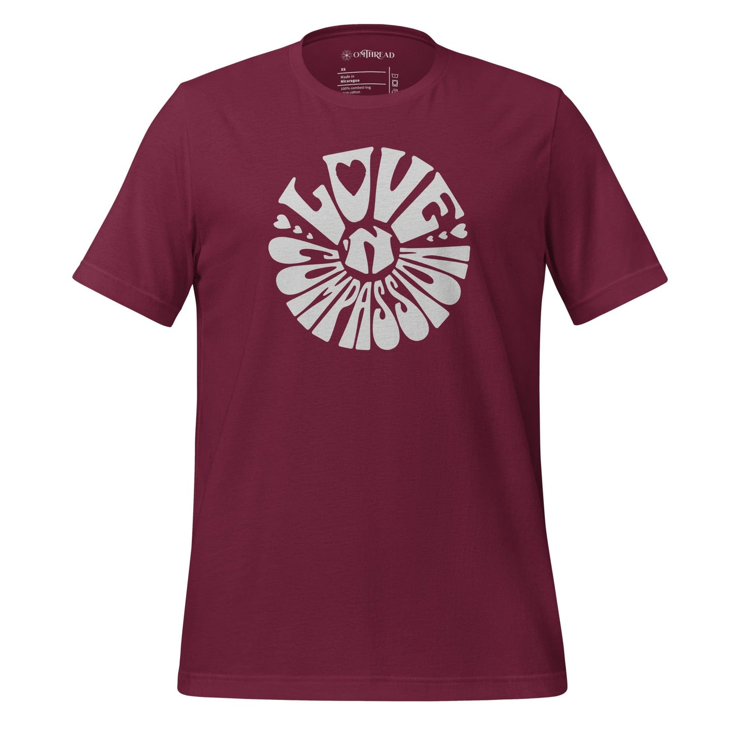 OMTHREAD maroon t-shirt with bold white "Love 'N Compassion" typography design in a circular layout