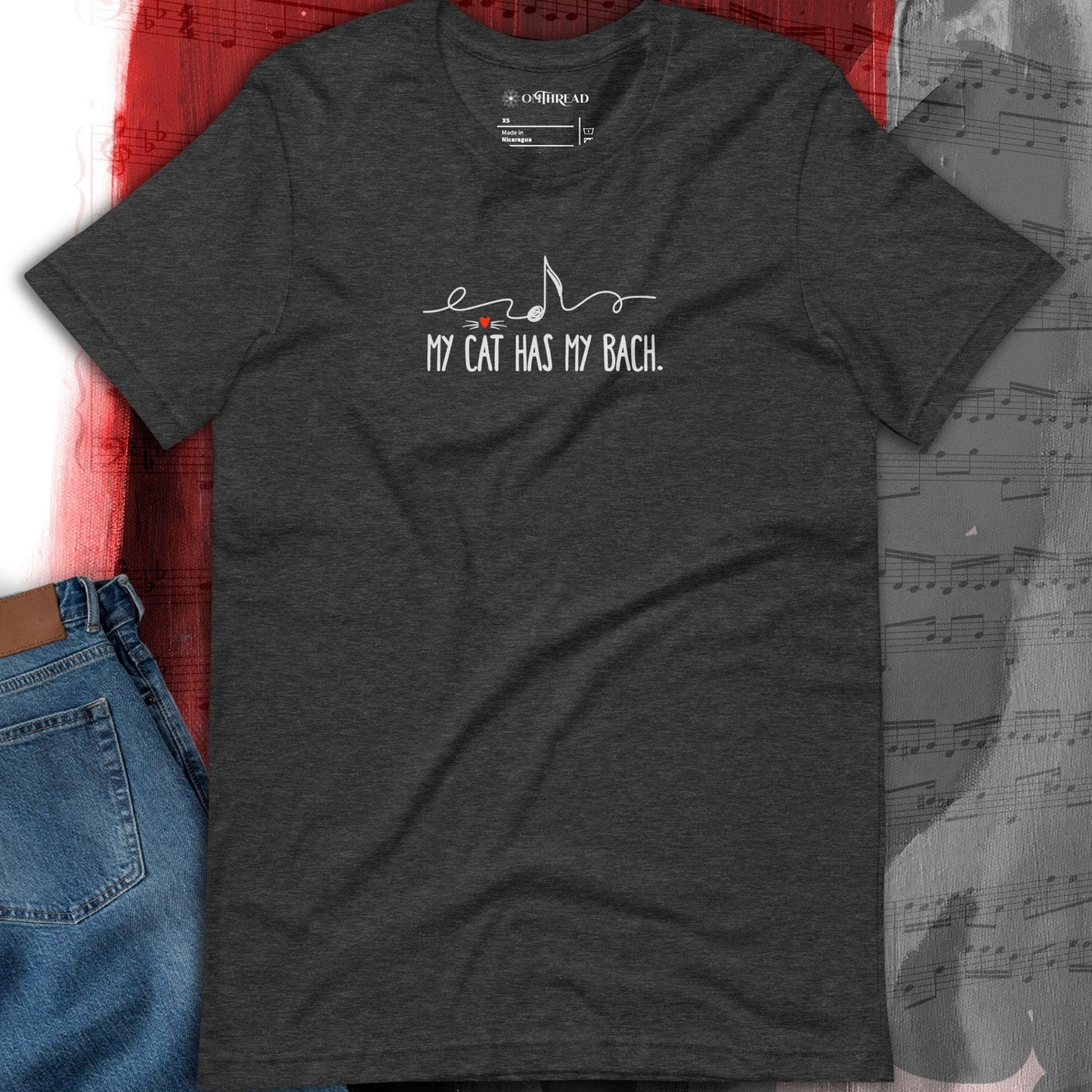 OMThread My Cat Has My Bach dark gray t-shirt featuring minimalist white text with a musical note design and a small red heart.
