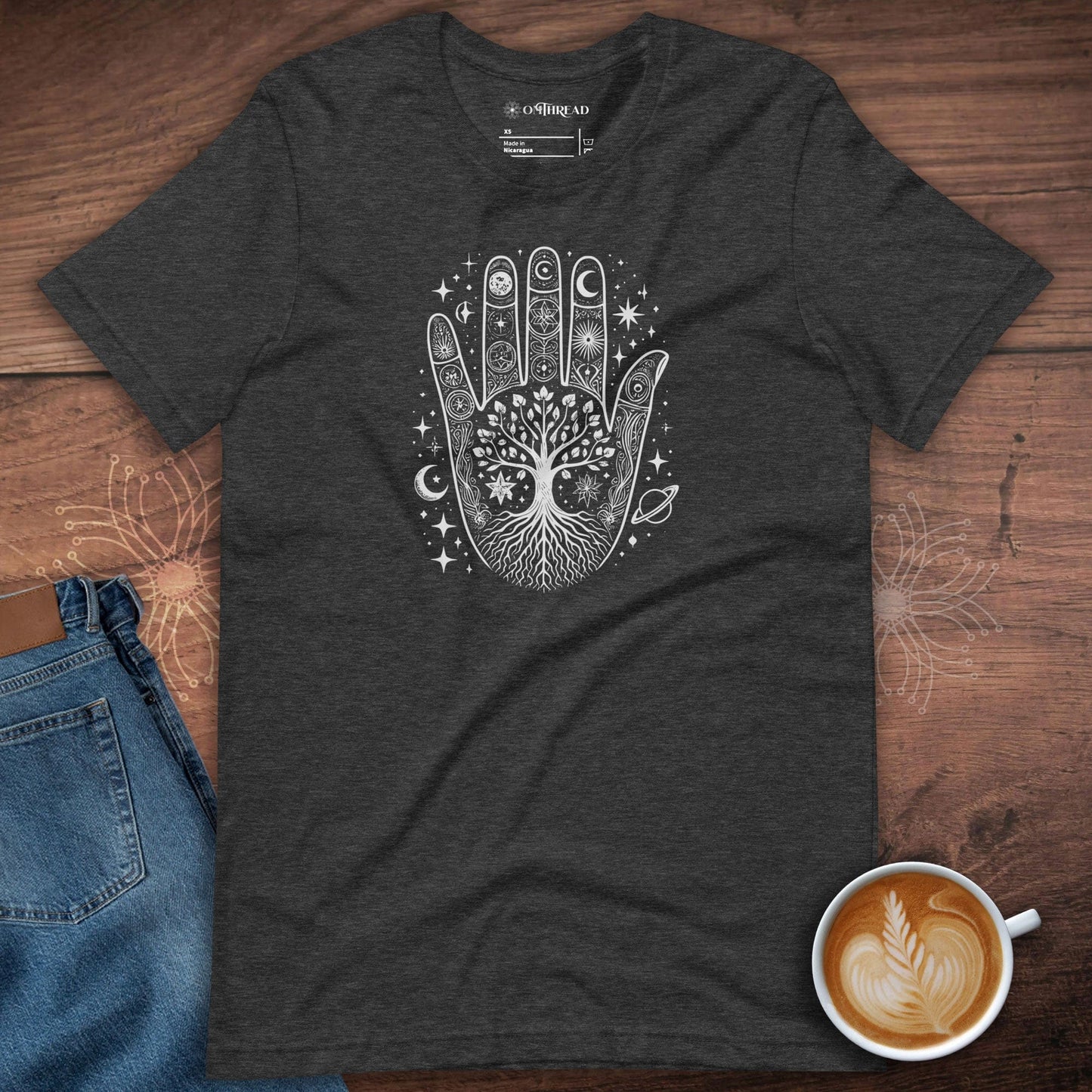 OMTHREAD dark grey heather t-shirt featuring an intricate cosmic hand design with celestial symbols, stars, and a tree of life, symbolizing spiritual connection and universal harmony.