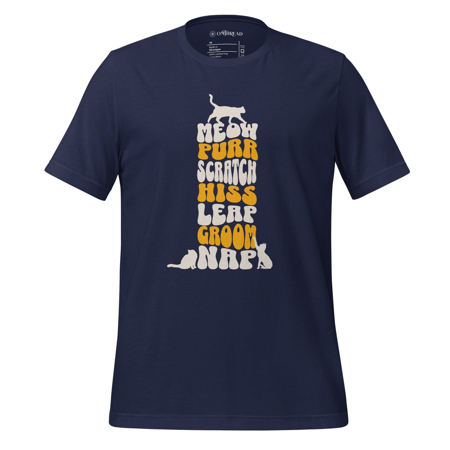 OMTHREAD navy t-shirt featuring a vertical stack of bold, playful typography with the words meow, purr, scratch, hiss, leap, groom, and nap. Small cat silhouettes accent the top and bottom of the text.