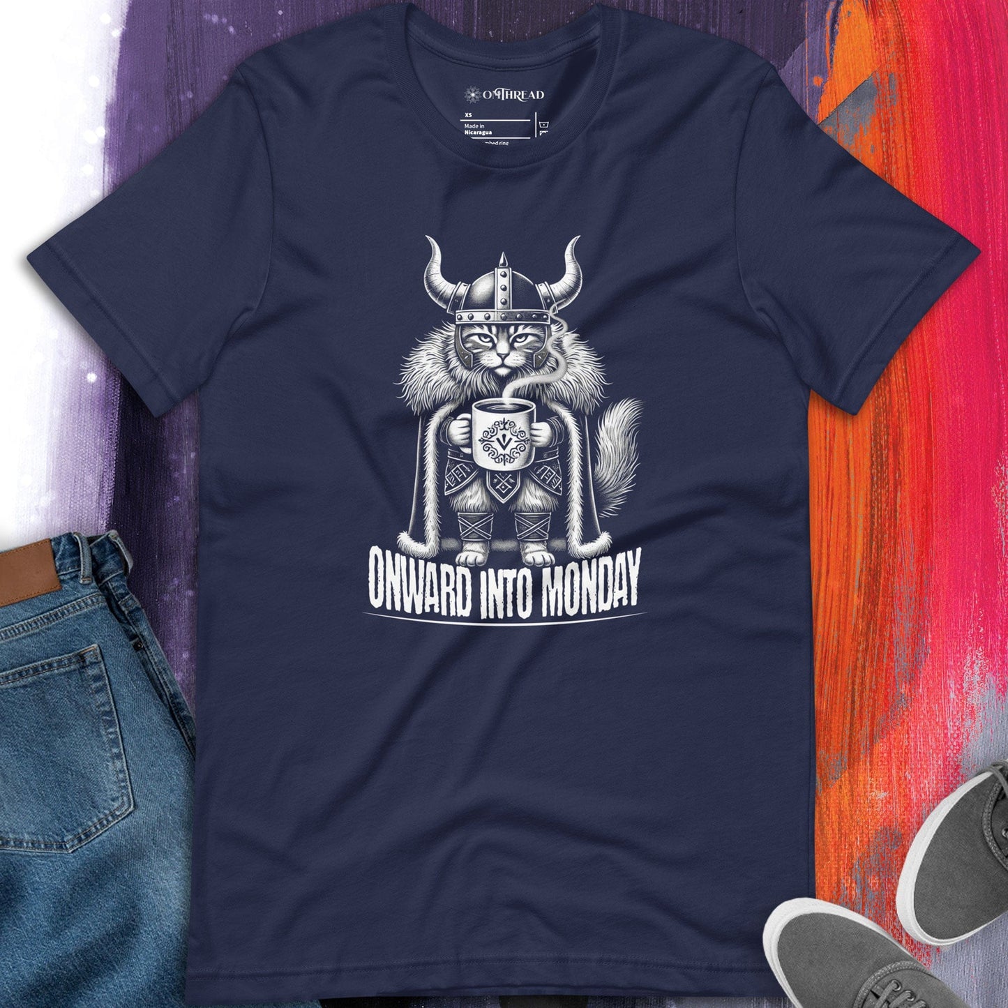 OMThread Onward Into Monday navy t-shirt featuring a Viking cat holding a coffee cup, wearing a horned helmet and fur cloak, with the phrase "Onward Into Monday" below