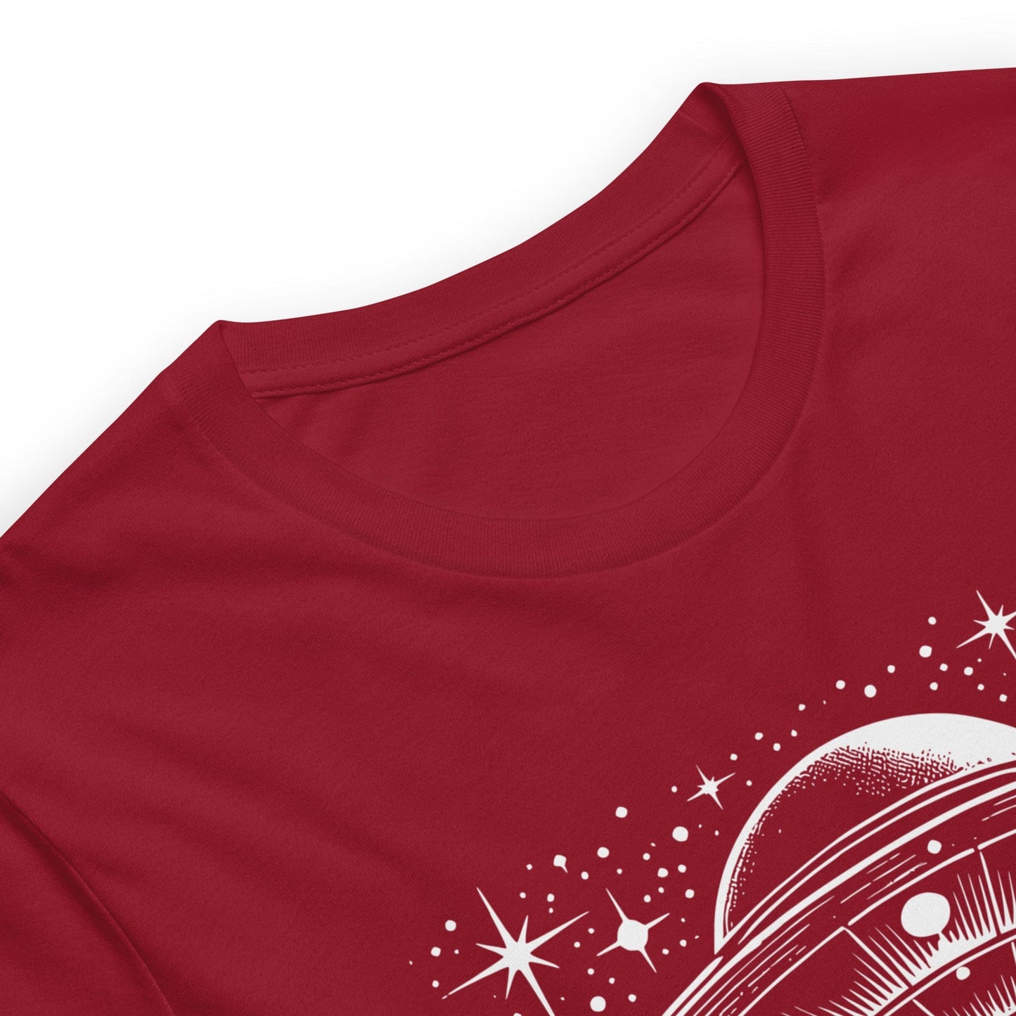 Crimson red t-shirt featuring a retro-style illustration of a UFO beaming light down onto a forest, surrounded by stars and clouds, with the bold text, NOPE! emphasizing humor and alien themes