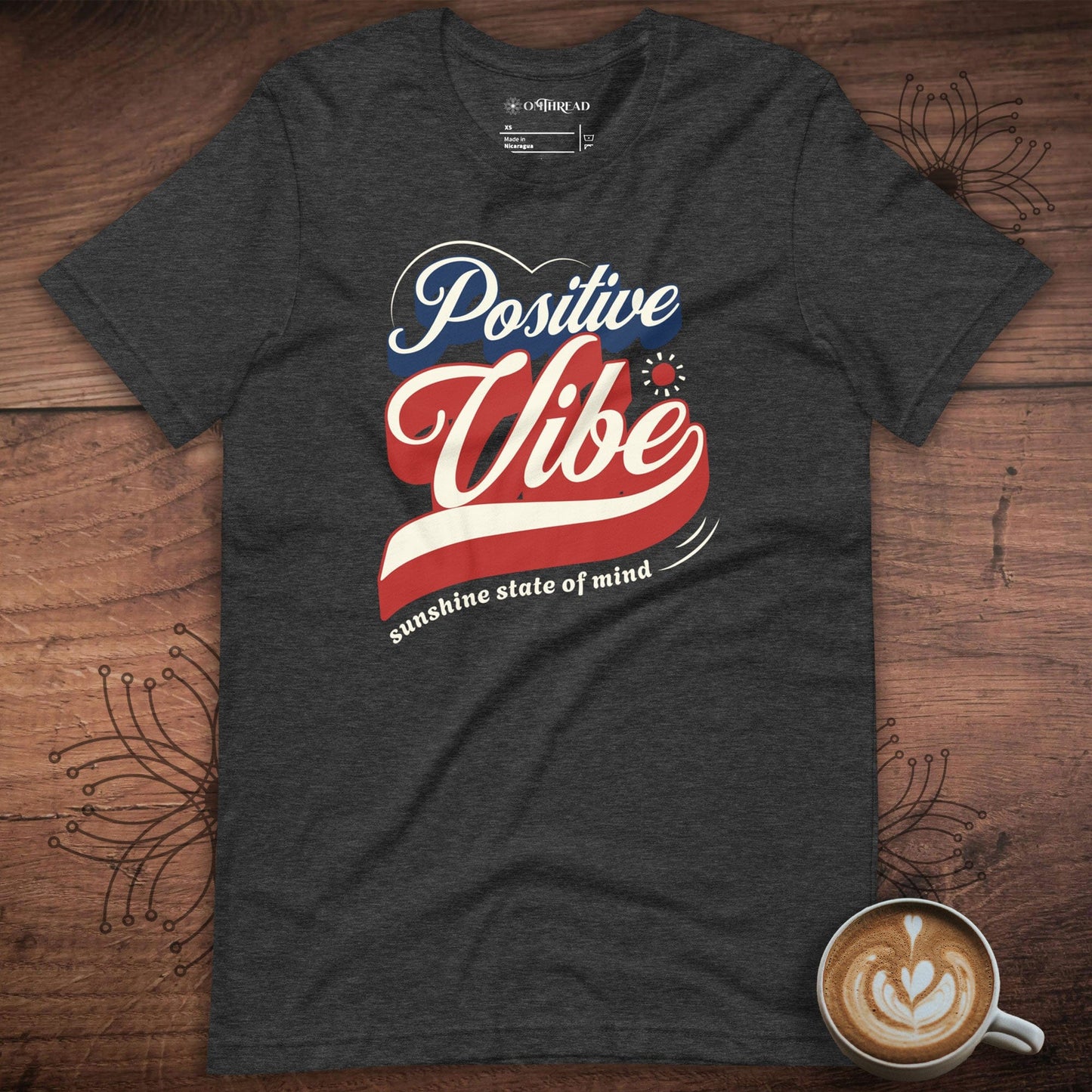 OMTHREAD dark grey heather t-shirt with retro-style Positive Vibe design in red, white, and blue, featuring sunshine state of mind typography