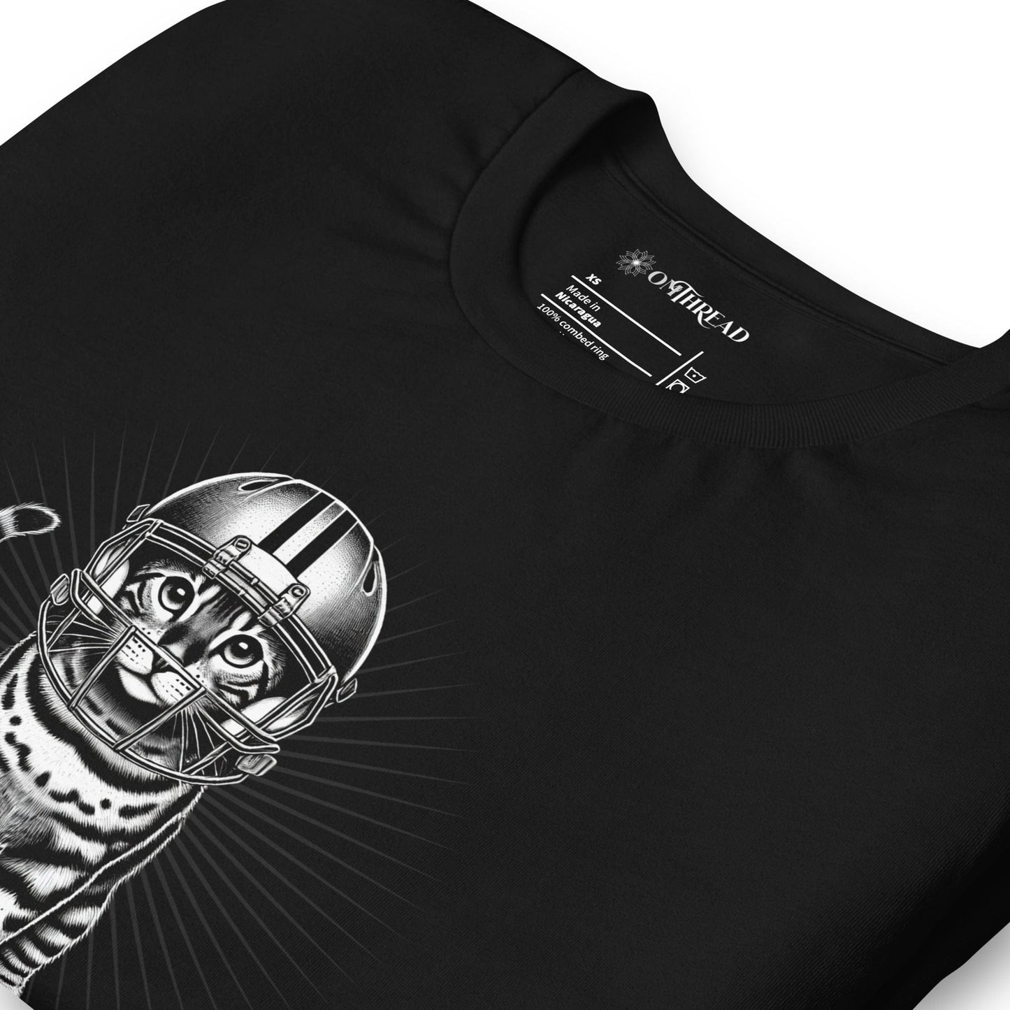 OMTHREAD black t-shirt featuring a Bengal cat in a football helmet with "Put Me In Coach" text. The cat stands with bold linework and a radiant background.