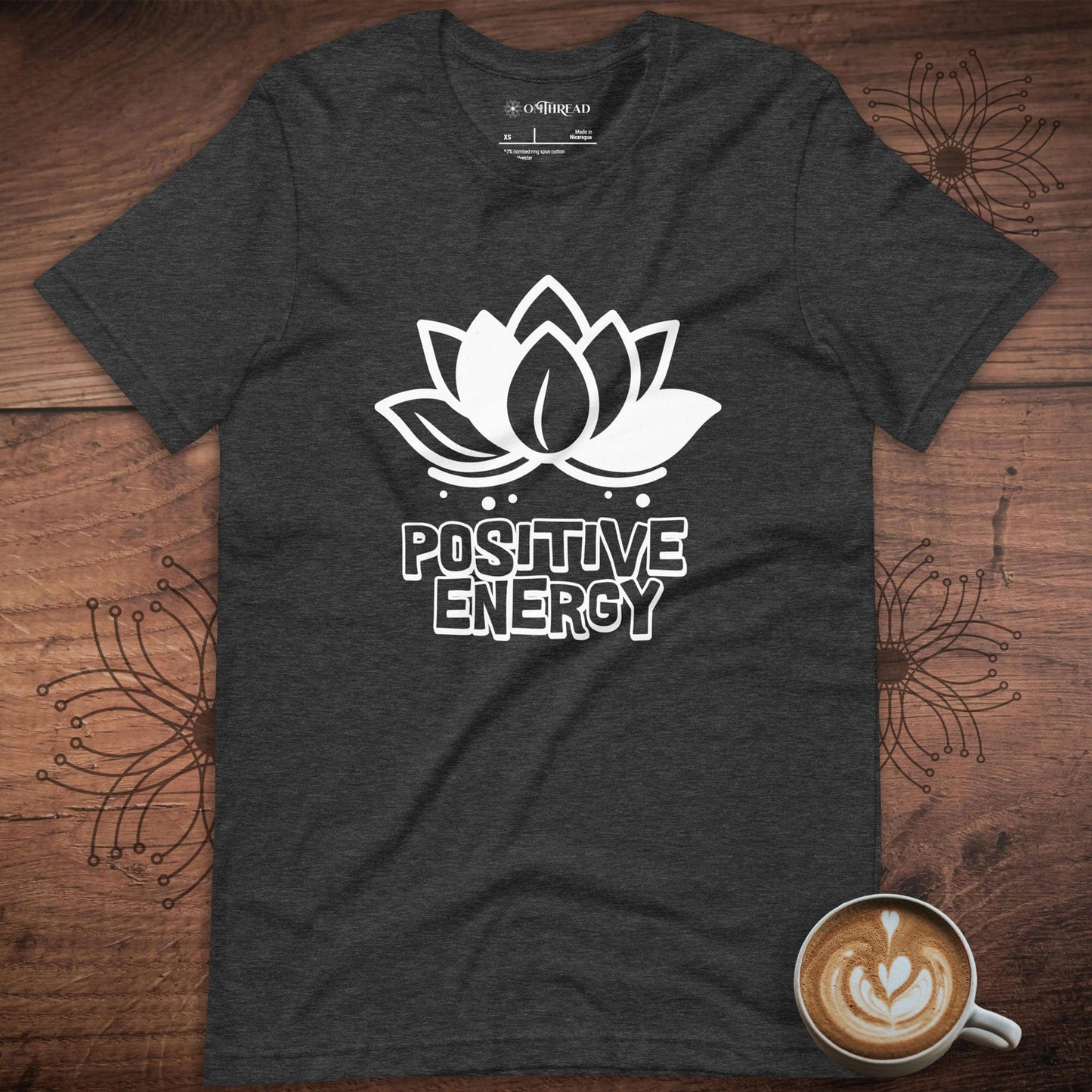 OMTHREAD Dark Grey Heather Radiate Positive Energy Motivational Tee with a lotus flower design and bold text 'Positive Energy' in white.