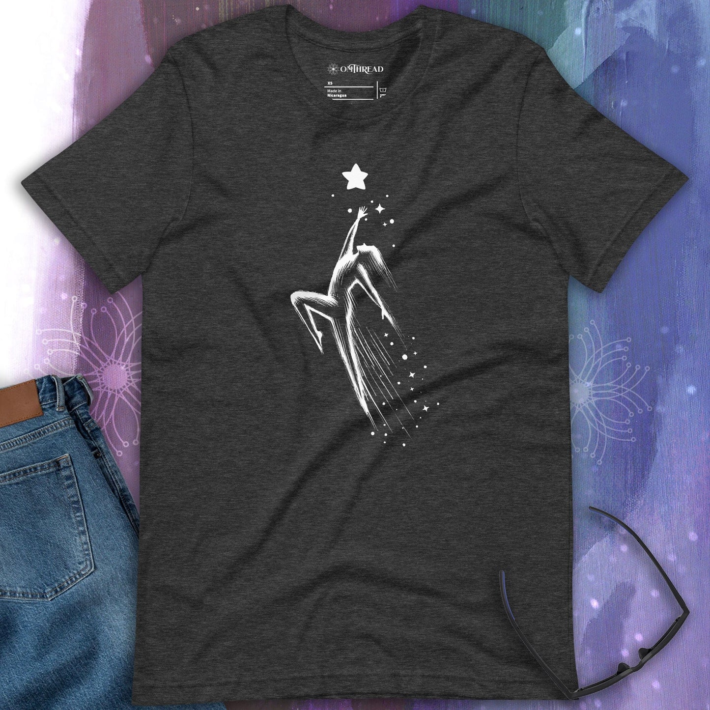 OMTHREAD dark grey heather t-shirt featuring a dynamic white illustration of a figure reaching for a star, with a cosmic-inspired trail.