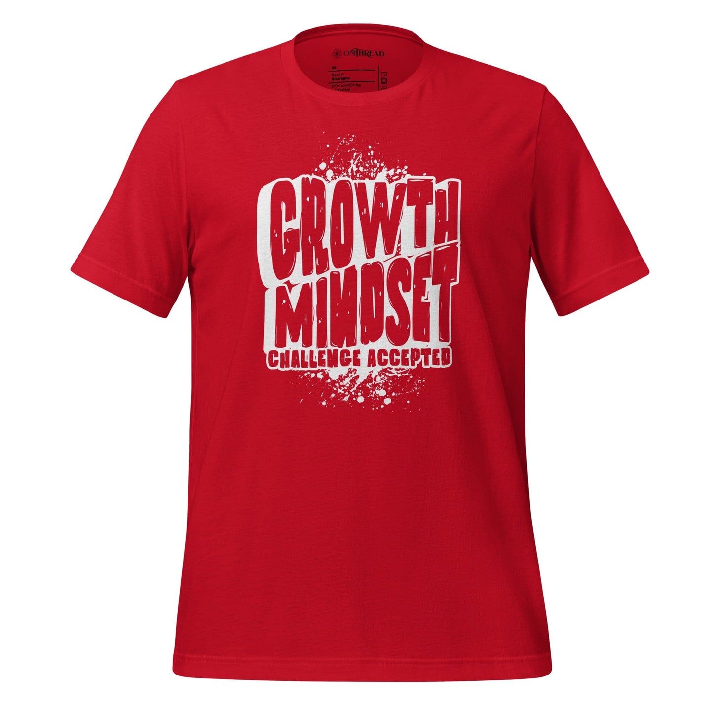 OMTHREAD red t-shirt with bold white text reading "Growth Mindset Challenge Accepted" in a distressed font, laid flat on a colorful background with flowers and denim.