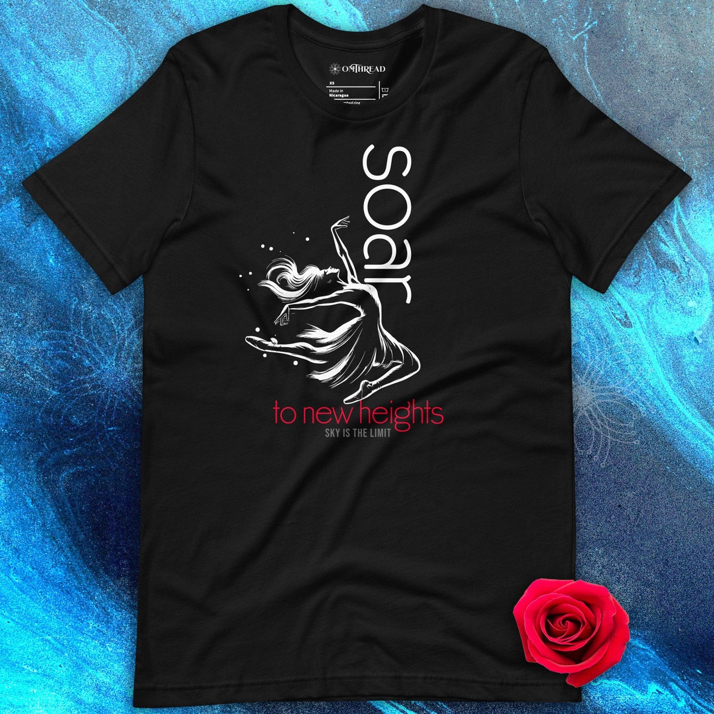 OMTHREAD black t-shirt featuring a white ballet dancer illustration with "Soar to New Heights" in white and red text.