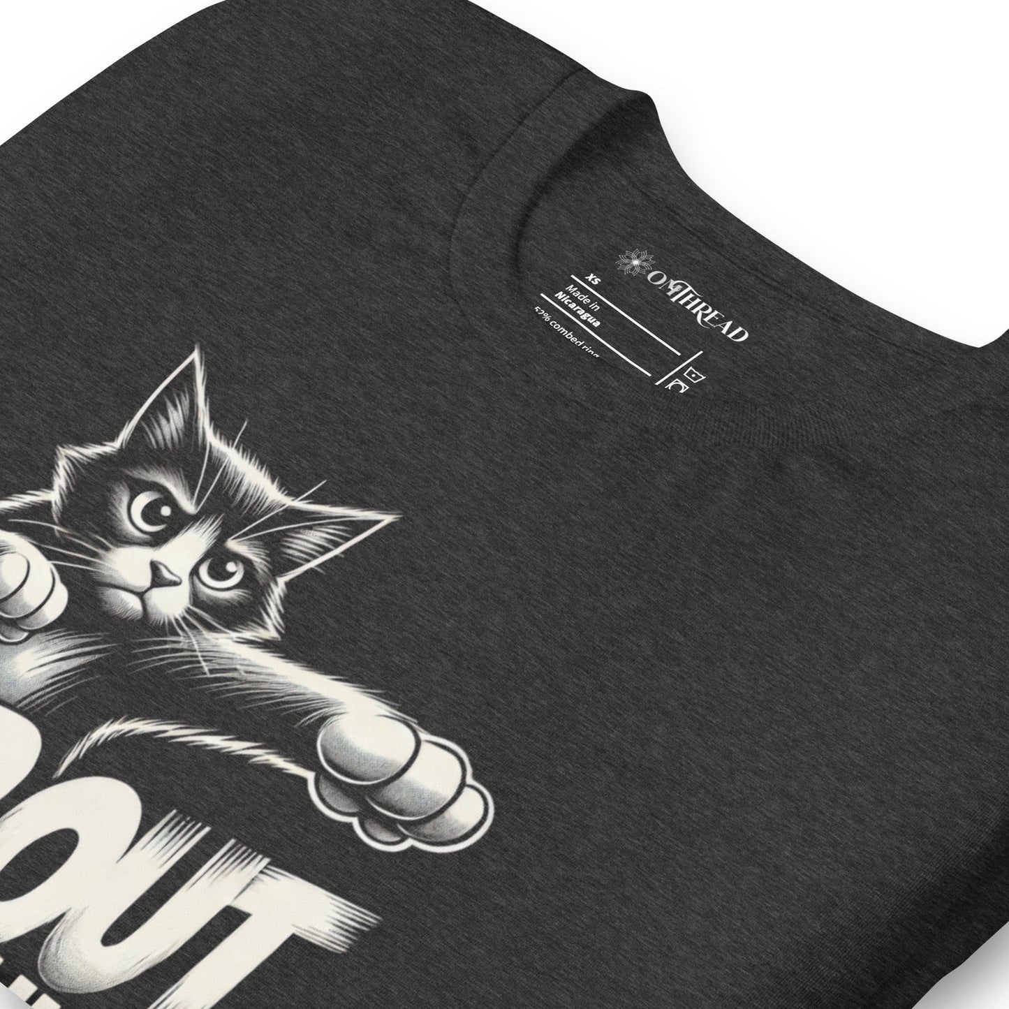Dark gray t-shirt featuring a comic-style design of a fierce black-and-white cat throwing punches. The text 'TAP OUT BRUH' appears in bold, dynamic lettering.