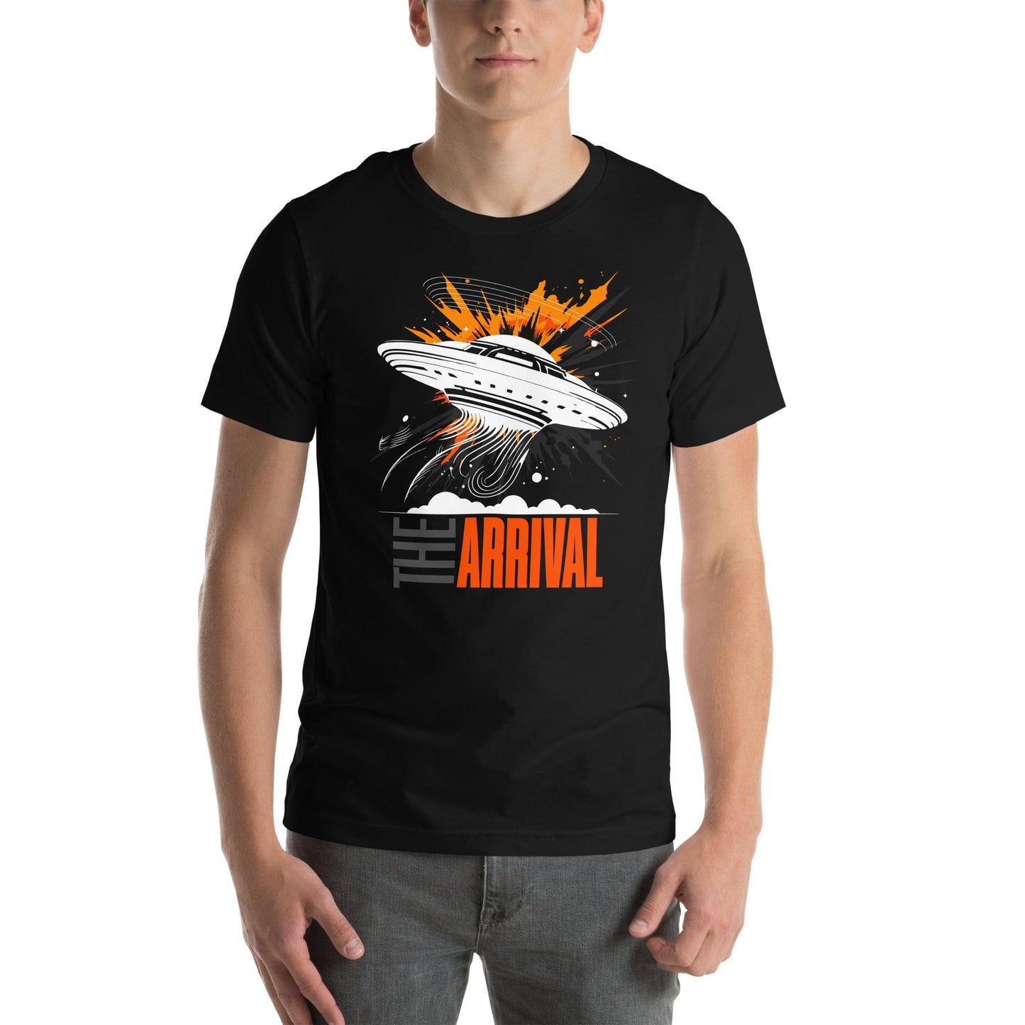Man wearing black t-shirt showcasing a bold design of a UFO emitting glowing beams, surrounded by explosive orange accents, clouds, and dynamic motion lines, with the text, THE ARRIVAL in contrasting gray and orange, blending sci-fi and graphic art.