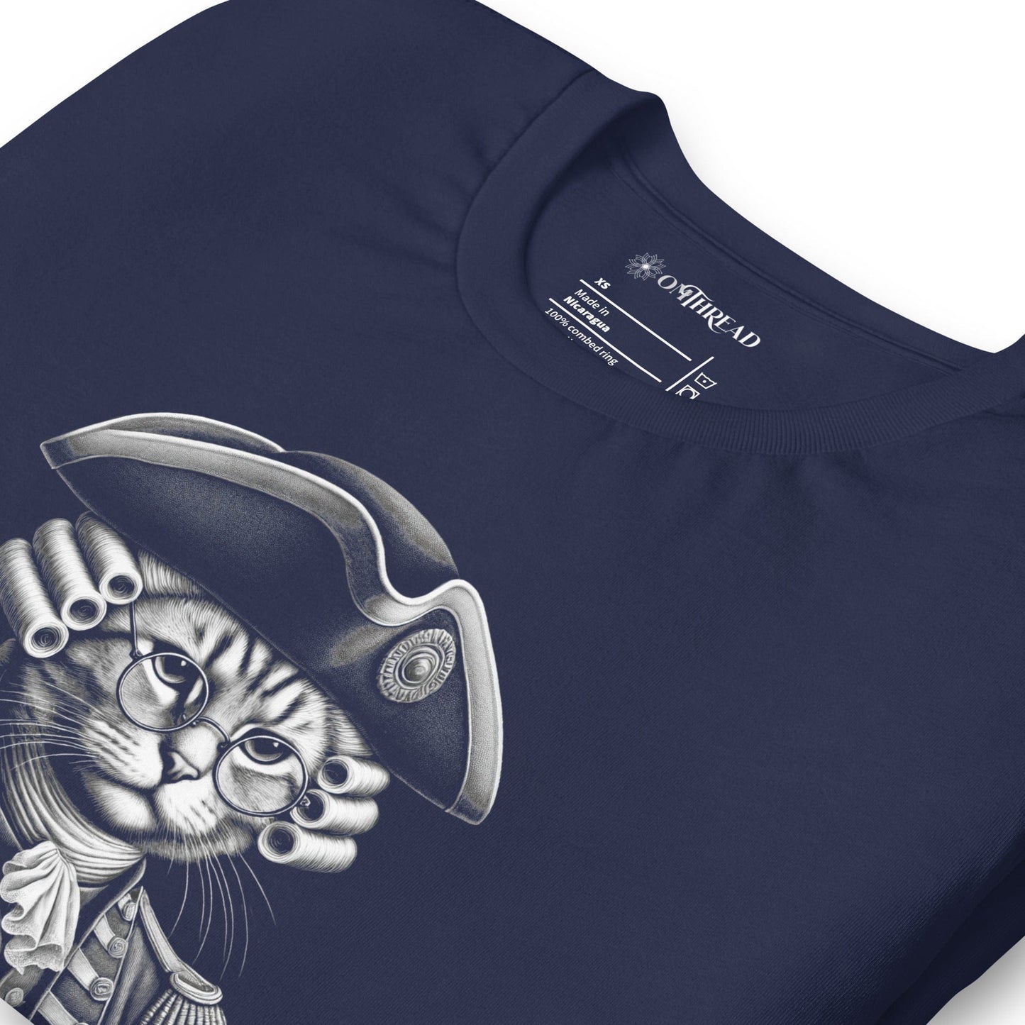 Navy blue t-shirt featuring a colonial-style cat in 18th-century revolutionary attire, complete with a powdered wig and glasses. The banner below reads, The Right to Purr and Bear Claws in bold lettering, surrounded by stars.