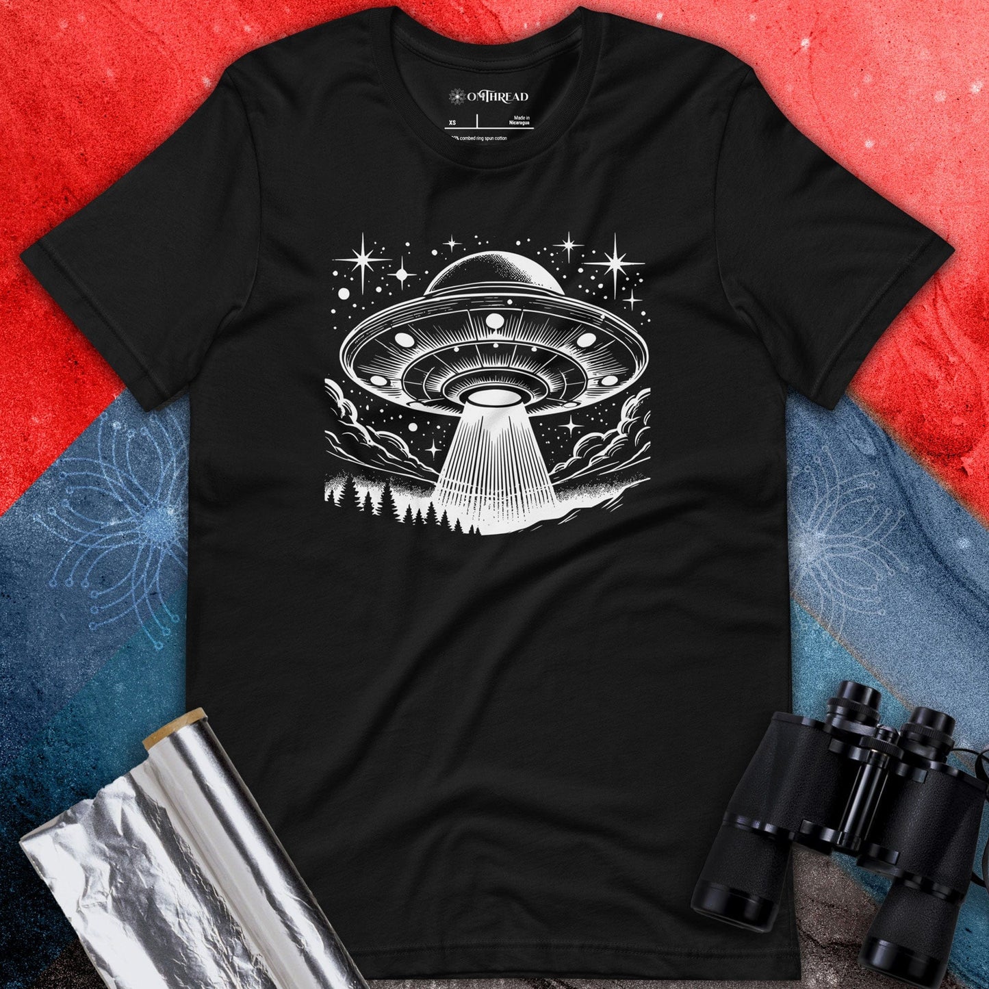 OMTHREAD UFO in the Night Sky Tee, black t-shirt featuring a UFO design with a beam of light in the night sky, surrounded by stars and clouds.