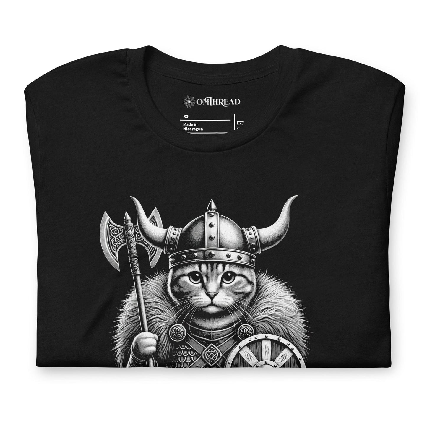 Black t-shirt featuring a Viking cat warrior wearing a horned helmet, fur cloak, and armor, holding an axe and shield. The word 'VALHALLA' is displayed below.