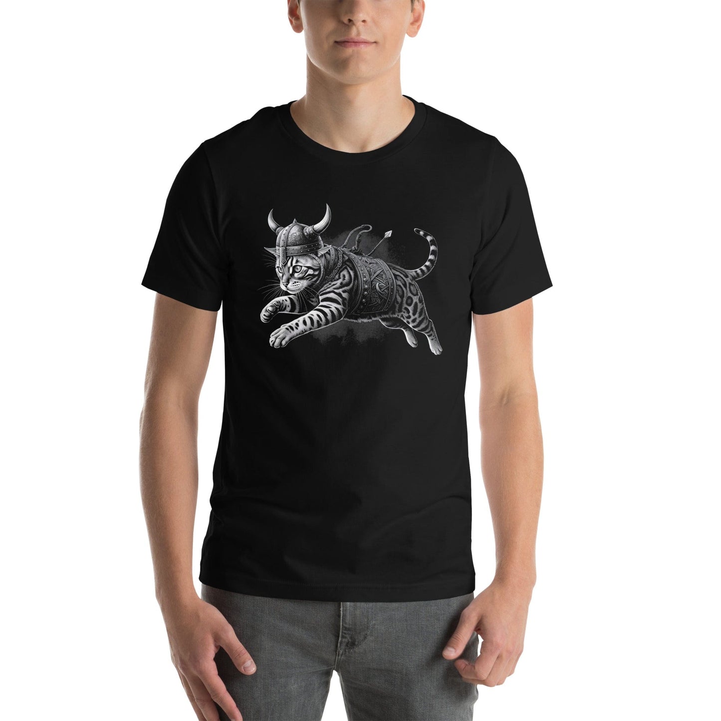 Male model wearing a black t-shirt featuring an illustration of a fierce Bengal cat dressed as a Viking warrior, complete with a horned helmet, armor, and weapons, leaping into action.