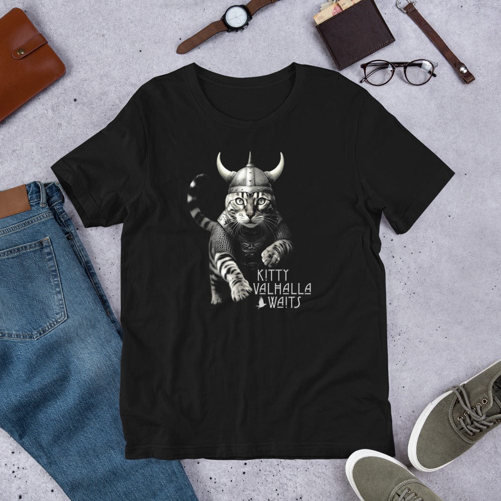 Black t-shirt featuring a Viking warrior cat design. The artwork showcases a fierce Bengal cat clad in detailed Norse armor, wearing a horned helmet and extending its paw forward in an action pose. Below the illustration, the stylized text reads 'Kitty Valhalla Waits.' The background includes subtle Viking runes and battle-inspired elements. Perfect for Norse mythology fans, cat lovers, and fantasy enthusiasts.