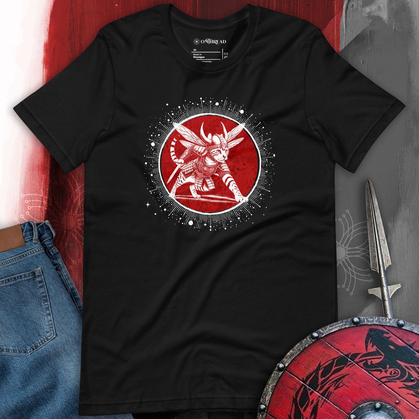 OMTHREAD Viking Warrior Cat T-Shirt - Black tee featuring a fierce feline warrior in Norse armor with a red cosmic circle. Mythology-inspired graphic for cat lovers and Viking fans.