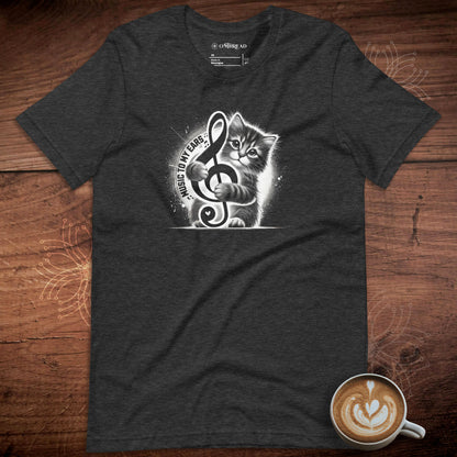 Music to My Ears Cat T-Shirt – Adorable kitten clutching a treble clef on a dark heather tee. Perfect for cat lovers, musicians, and music enthusiasts.