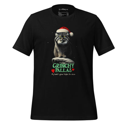 Black t-shirt featuring a Pallas cat wearing a Santa hat, sitting on a snowy rock with a grumpy expression. The text below reads 'GRINCHY PALLAS' in green and red, with the phrase 'My heart grew triple its size' underneath.