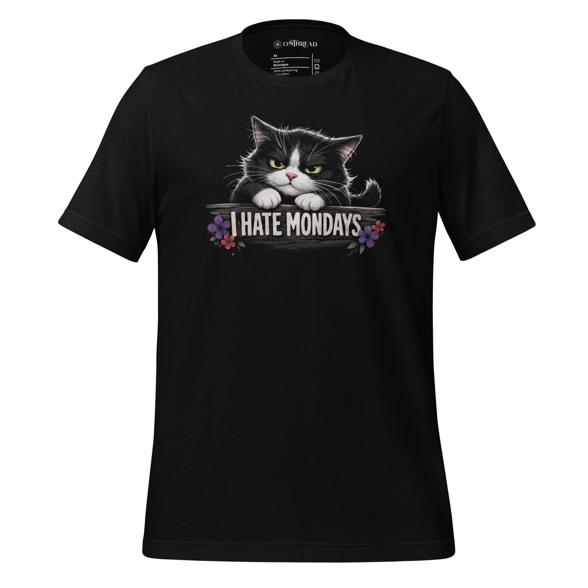 OMThread black t-shirt with grumpy tuxedo cat peeking over “I HATE MONDAYS” text, small floral accents, funny cat lover graphic tee
