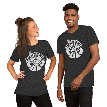 Man an woman wearing charcoal t-shirt featuring a retro-style design with the words 'Coffee & Cats' in bold, curvy white lettering. The design includes small illustrations of a steaming coffee cup and a cat silhouette within the text.