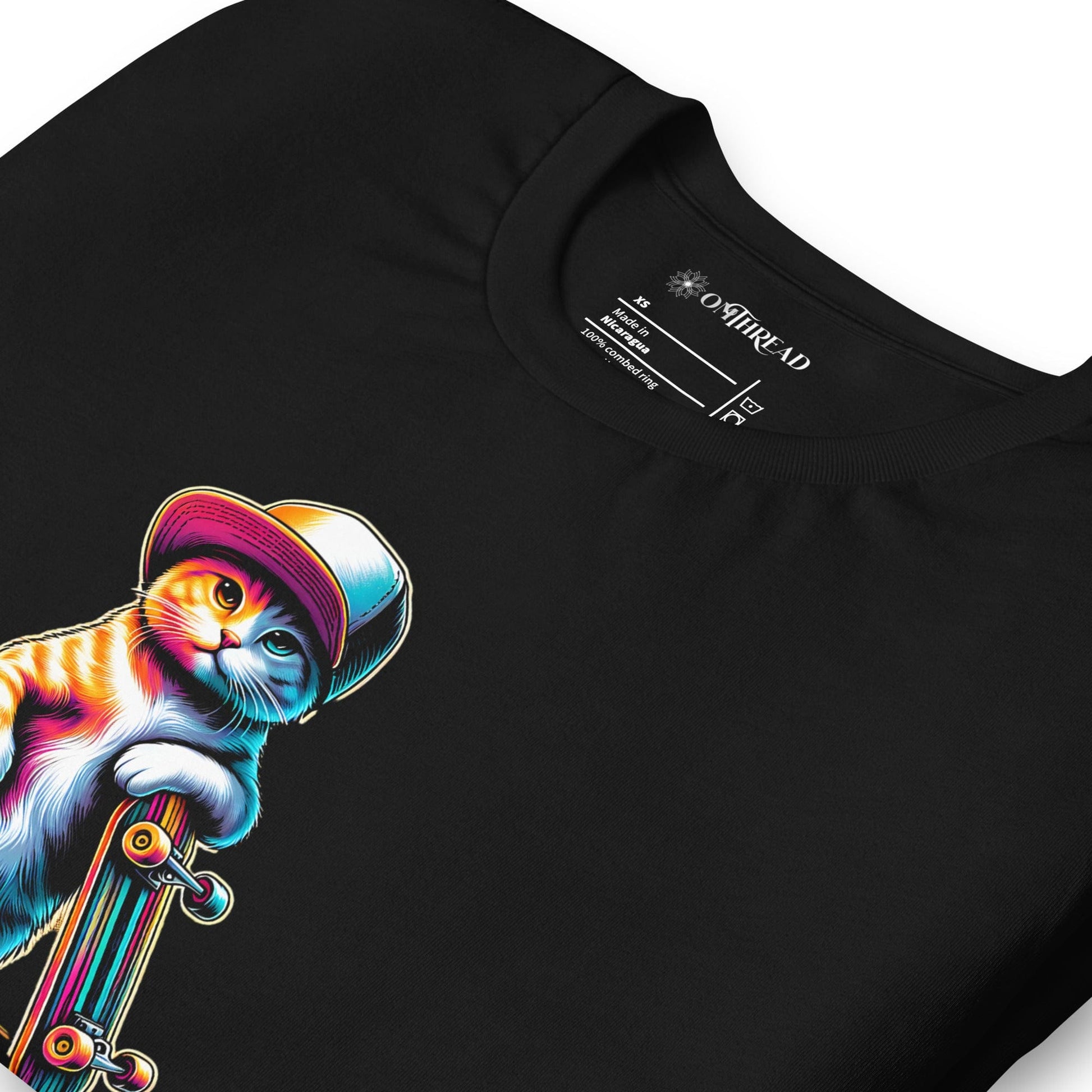 Black t-shirt featuring a colorful illustration of a cat in a hat holding a skateboard. Below the cat, the word 'SKATER' is spelled out using periodic table elements: Sulfur (S), Potassium (K), Astatine (At), and Erbium (Er).