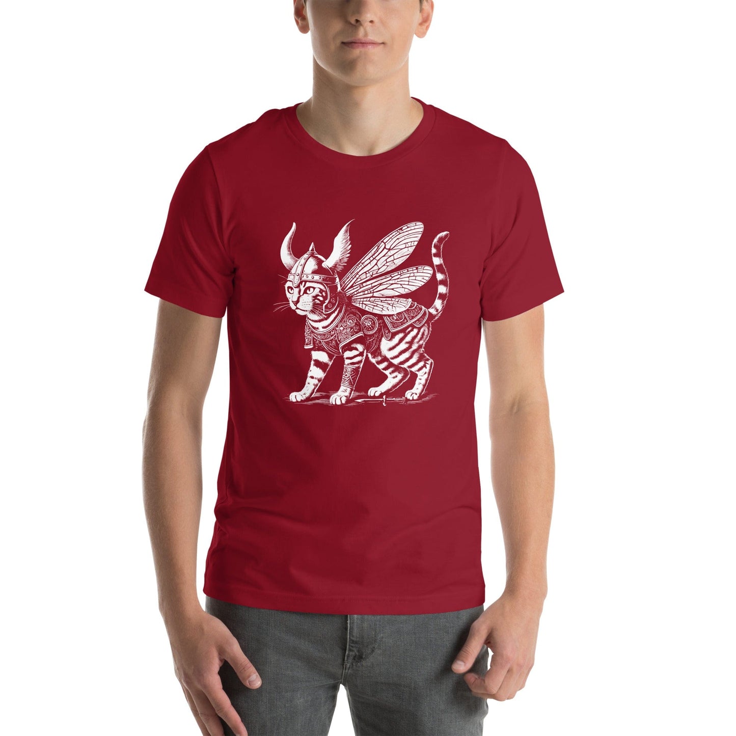 Man wearing a red t-shirt featuring a detailed illustration of a cat dressed as a Viking warrior, complete with armor, horned helmet, and insect-like wings. The cat stands confidently with intricate linework and patterns enhancing the design.