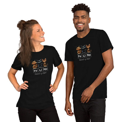 Models wearing a black t-shirt featuring three mischievous kittens sitting above the word 'FeLiNe,' spelled out using periodic table elements: Iron (Fe), Lithium (Li), and Neon (Ne). Below, the phrase 'Elements of Chaos' is written in cursive font.